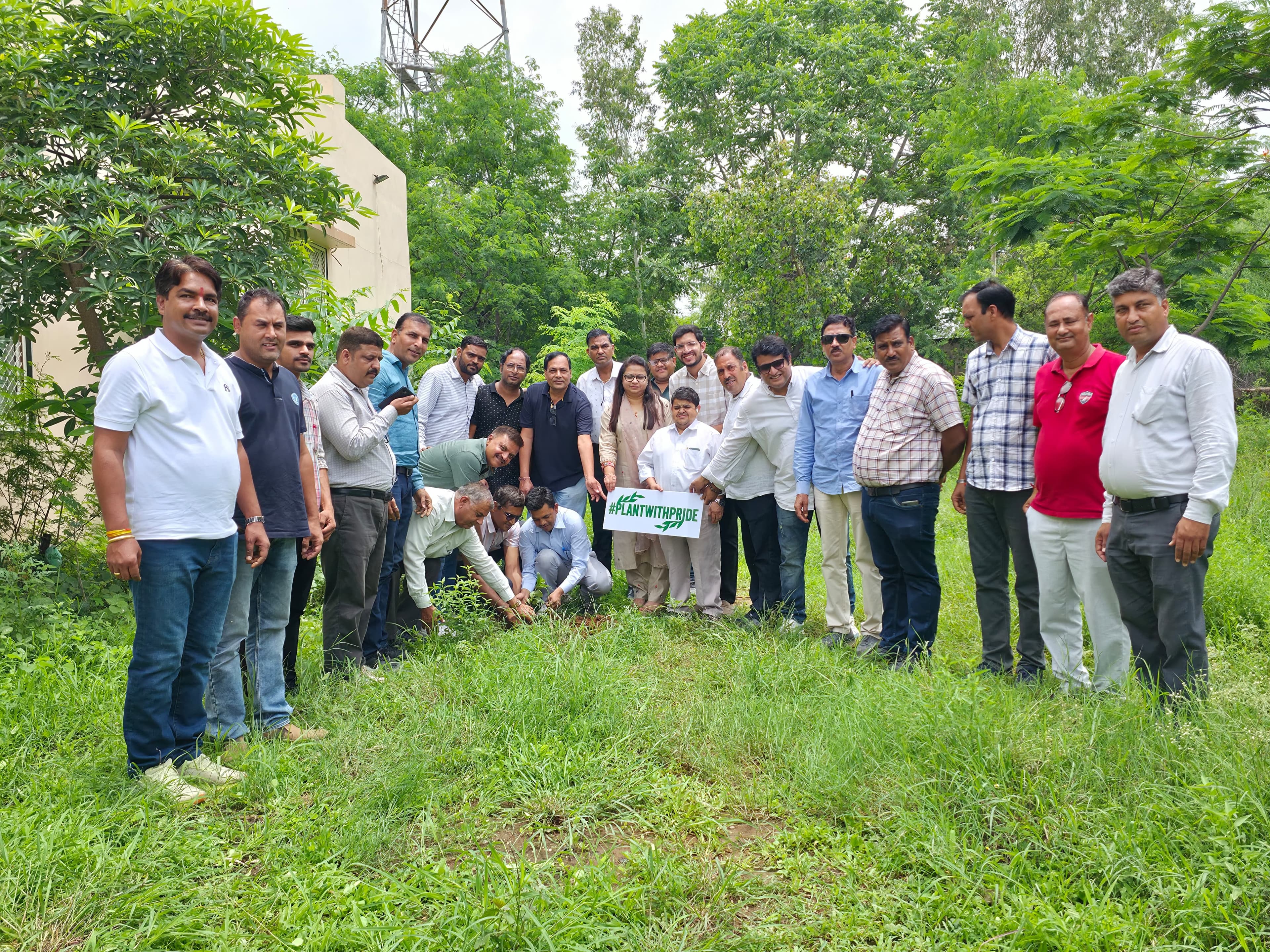 Corporate volunteers planting native trees for CSR compliance